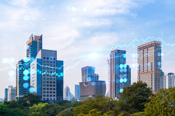 Forex and stock market chart hologram over panorama city view of Bangkok, the financial center in...
