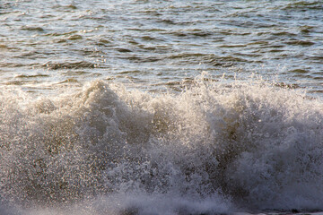 Stormy Black sea. Water background, stormy weather, waves and splashes in Batumi, Georgia.