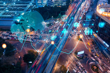 Fototapeta na wymiar Research and development hologram on aerial view of road, busy urban traffic highway at night. Junction network of transportation infrastructure. Concept of innovative logistics. Double exposure.