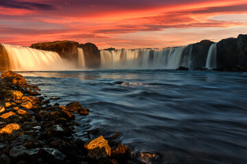 Fototapeta premium Fantastic nature landscape of Iceland during sunset. Wonderful View on Godafoss Waterfall with colorful sky. Travel on car is a Lifestyle, conception. Idea of Adventure lifestyle. Popular travel place