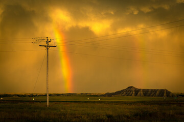 rainbow through power lines in the morning
