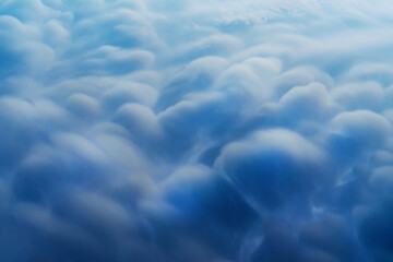 Blue Cumulus clouds, a rare atmospheric phenomenon.