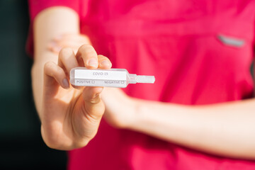 testing for coronavirus. In the hand is a test tube with a sample of the patient.