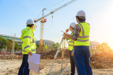 Civil engineer inspects work using radio communication with the management team in the construction...