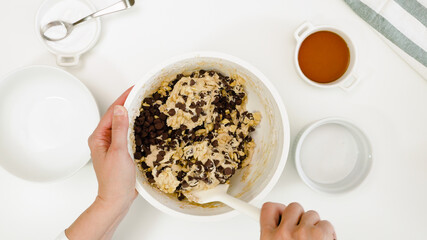 Mixing Chocolate Chip Cookie batterin a bowl, view from above