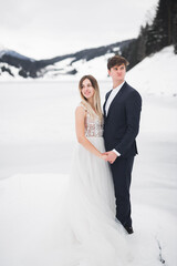 Wedding couple bride and groom holding hands