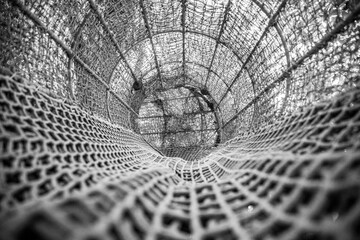 circular net structure with knots background black and white