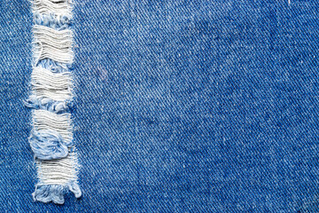 Denim texture background. Blue Jeans textile pattern in close up. Indigo fabric material with copy space for fashion cloth