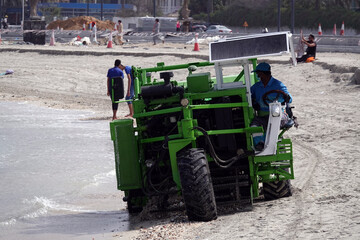 Special tractor collects shells on the shore