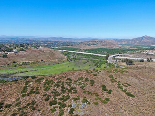 Aerial view of Rancho Bernardo mountain with freeway road on the background, East San Diego County, California, USA 