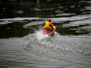 RC controlled jet ski model on lake. Active summer vacation for school child.