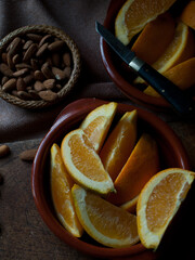 Rustic simple oranges and almonds with vintage pocket knife.
