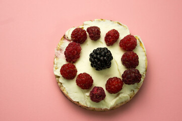 Diet dessert consisting of curd cheese, slice, raspberries and blackberries. Delicious and healthy breakfast.