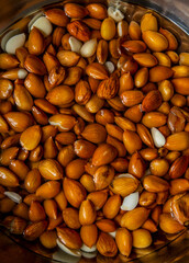 almonds as background, top view. Healthy snack. Wet almonds. Peeled almond