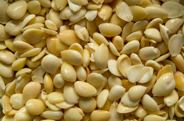 almonds as background, top view. Healthy snack. Wet almonds. Peeled almond