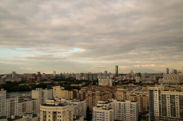 Fototapeta na wymiar view of the tops of houses in the metropolis