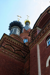 Orthodox old Church of red brick, close.