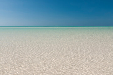 Fototapeta na wymiar Perfect Tropical Caribbean White Sand Beach And Crystal Clear Turquoise Water, Holbox, Mexico