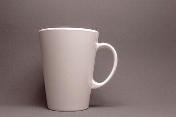 white plastic cup on gray background
