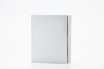 White book with no title standing on white background