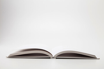 White book with no title standing on white background