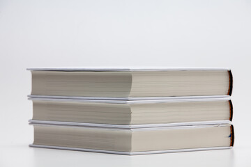 Pile Stacked white blank books on white background
