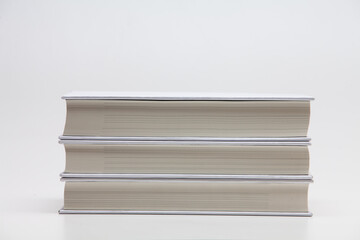 Pile Stacked white blank books on white background