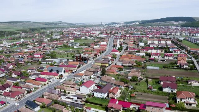 Aerial shot of a small town on the outskirts of Cluj, Romania. Gilau