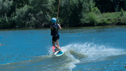 
girl doing weyboard. water tricks