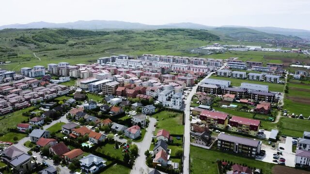 Aerial shot of a small town on the outskirts of Cluj, Romania. Gilau