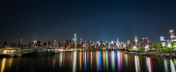 Fototapeta na wymiar New York City View at Night with water reflection, wide angle, wide view