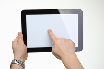 Close up of man that holding tablet while testing new online application, isolated on white background