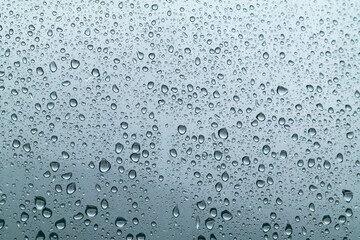 a scene of heavy rain on a clean glass window.