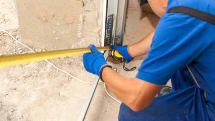 Professional worker install garage doors at new house