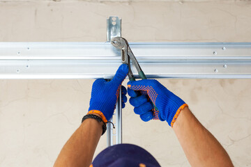 Professional worker install garage doors at new house