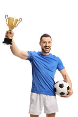 Soccer player holding a ball and a golden trophy cup