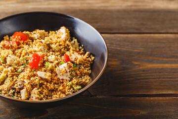 Couscous with turkey, tomatoes, champignon mushrooms and avocado.