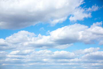 Naklejka na ściany i meble Blue sky and white clouds. Beautiful nature background. Summer vibes.