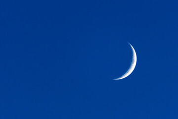 Obraz na płótnie Canvas Sickle-shaped Moon in the Sky