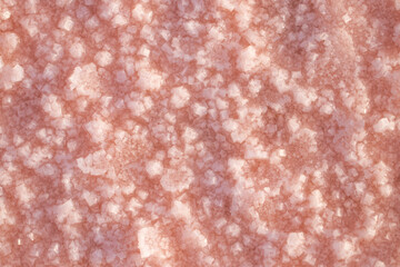 Background texture sea pink salt. Salt crystals close up. Pink salt lake