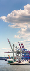 Vertorama of a container terminal in the port of hamburg in good weather 