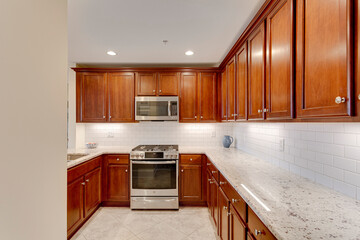 Traditional Kitchen wood cabinets stainless steel appliance white subway backsplash modern stone countertop granite marble wine cooler bar stool