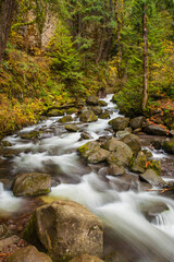 Multnomah creek rushing through a rocky streambed, a short distance upstream from Multnomah falls.