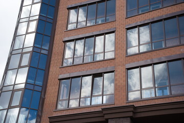 glazed balcony on which the sky is reflected