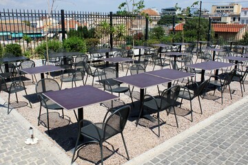 Greece, Athens, July 16 2020 - Empty chairs and tables of a traditional restaurant in the touristic district of Plaka. 
