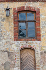 Fototapeta na wymiar old brick wall with windows