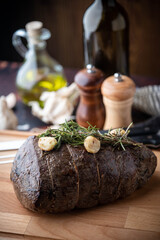 roasted eye of round chunk meat with rosemary and garlic