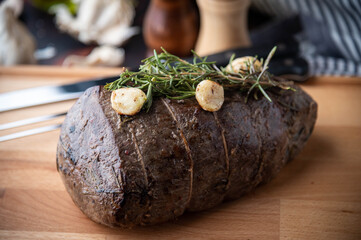 roasted eye of round chunk meat with rosemary and garlic