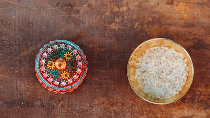 Fototapeta na wymiar Directly above shot of Rice besides clay bowl