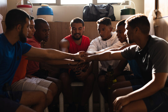Multi ethnic group of male football in changing room
